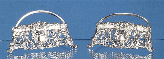 A pair of silver semi circular menu holders, by William Comyns, LENGTH; 3”/79mm Height; 1 ¾”/44mm
